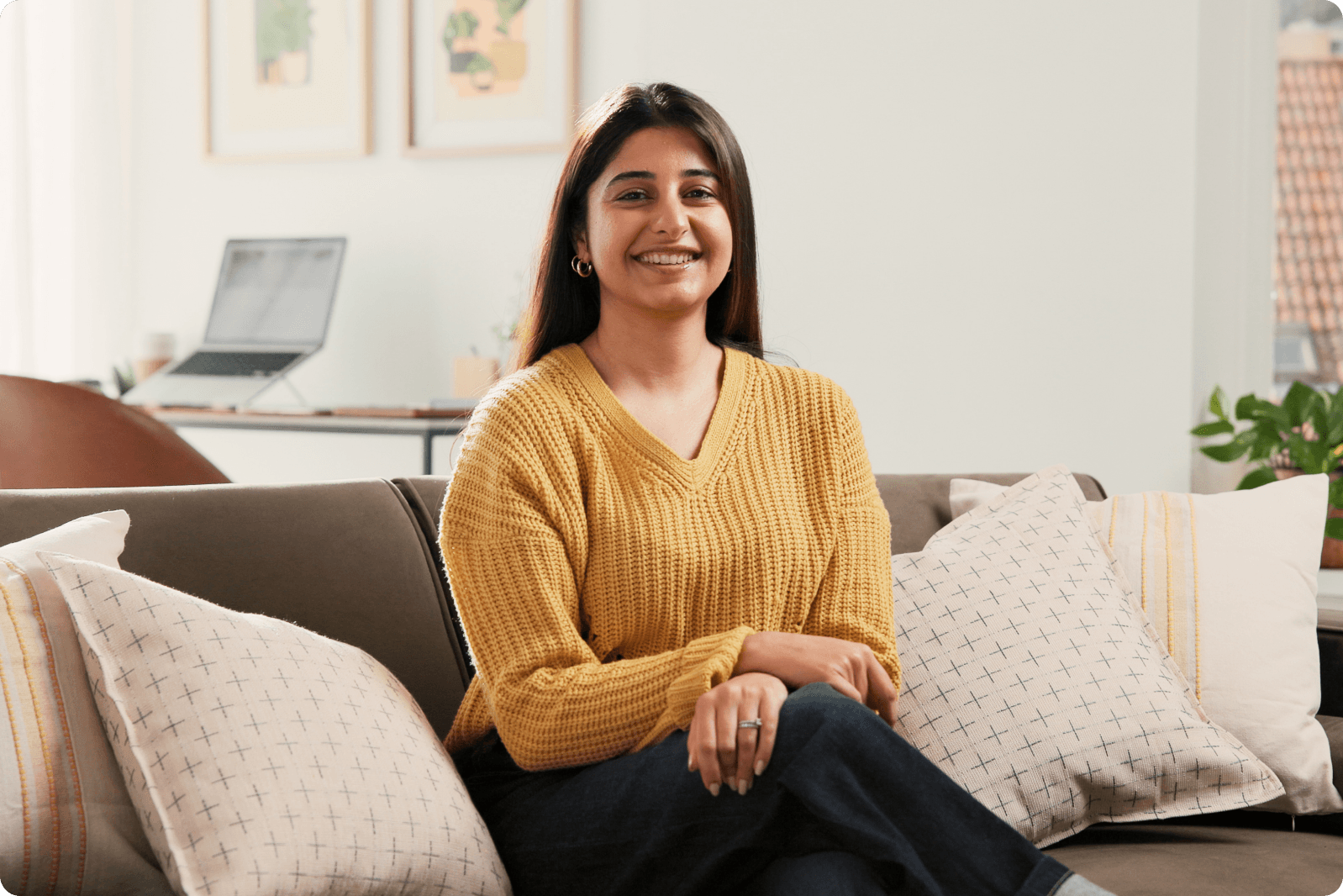 Therapist smiling in a comfortable home office setting